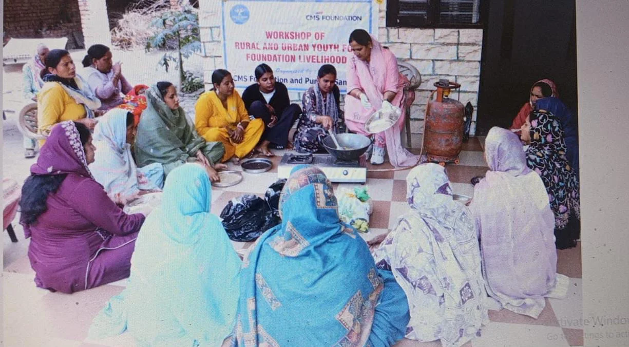 Women taking part in a traditional masala preparation workshop